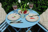 Set 4 piatti And Nook Vegetables in ceramica decorata con illustrazioni di verdure colorate come carote, ravanelli, mais e peperoni, diametro 22 cm.